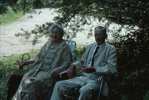 Ella and Arthur Rosenburg enjoy the shade at the Moon Barn Raising at entrance to Hopkins Forest on 2 August 1975.