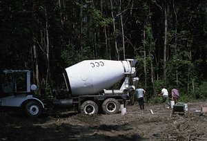 Moon Barn site preparation at entrance of Hopkins Forest. Cement mixer filling sonotubes for post footings.