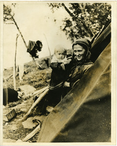 A Lapp mother with her baby, in the tent