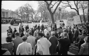 Counter-protesters in front of the White House across the street from the antiwar demonstration, carrying signs reading 'Students Wildly Indignant About Nearly Everything' [SWINE], 'We support US policy,' and 'They scream injustice and thus apease their cowardice': Washington Vietnam March for Peace