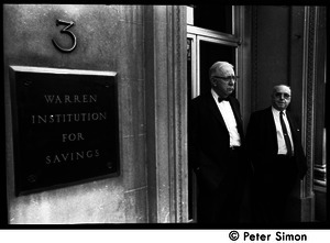 Two older men watching the march commemorating Martin Luther King, standing in the entrance to the Warren Institute of Savings (3 Park Street)