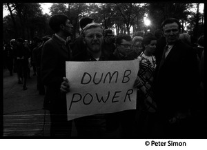 Protester at the George Wallace rally on Boston Common carrying a sign reading 'Dumb power'