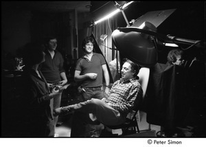 The Cars filming 'You Might Think': director Jeff Stein seated on dentist chair and surrounded by video crew