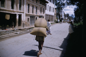 Porter with sack of grain