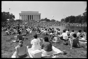 Crowd seated by the Reflecting Pond on the Mall watching speakers at the Lincoln Memorial, 25th Anniversary of the March on Washington