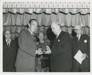 Jeremiah Milbank, Sr. handing a medal to Robert F. Wagner