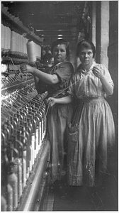 Two female textile workers at a spinning frame. [01]