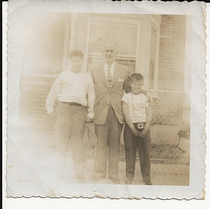 Firmo Correa with two of his grandsons