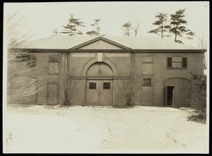 Exterior view of the Lyman Estate carriage barn in winter