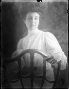 Portrait of a woman turned around in her chair