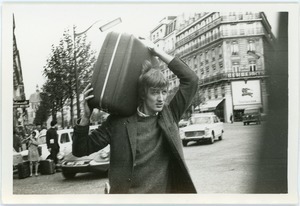 Jon Stielstra carrying suitcase