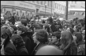 Protesters in the streets during the Counter-inaugural demonstrations, 1969, raising fists