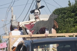 Parade marchers dressed in a meat suit and dog's ears : Provincetown Carnival parade