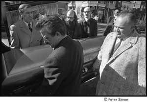 Jack Kerouac's funeral: pallbearers loading casket into the hearse, Allan Ginsberg center