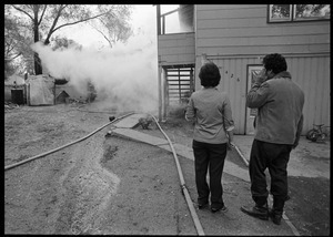 Man in anguish after learning that his garage was gutted by fire, and the family's cat was trapped inside