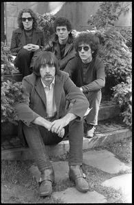 The Velvet Underground: (l.-r.) Maureen Tucker, Lou Reed, Doug Yule, and Sterling Morrison (front) posing in a circle garden