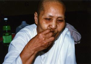 Chewing betel nut at a Money Tree celebration