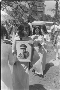 Women lament the death of their young Air Force lieutenants; Saigon.