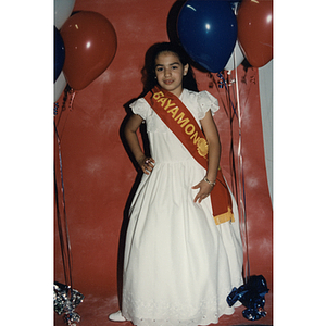 A girl wearing a Bayamon sash at the Festival Puertorriqueño