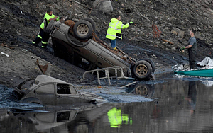 Workmen preparing a vehicles to be removed from Lake Massasoit (2020)