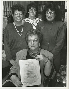 Kathleen Flynn holding Certificate of Appreciation