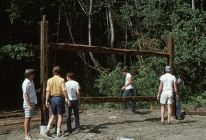 Erecting south barn wall at the Moon Barn Raising at entrance to Hopkins Forest on 2 August 1975.