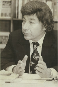 Mario D. Fantini, Dean of School of Education, sitting indoors, talking