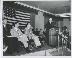 Bruce Barton at podium during graduation exercises