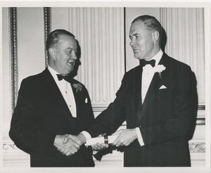 Unidentified men in tuxedos at an ICD event