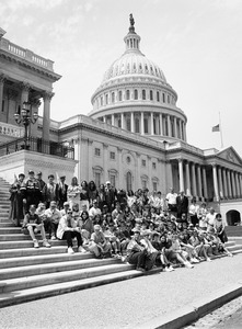 Congressman John W. Olver with group of visitors, posed on the steps of the United States Capitol building