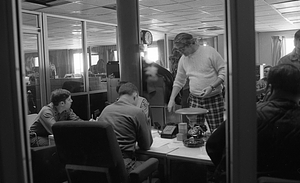 U.S. Army military policeman Gavigan and unidentified men in Boston Police Dispatch Operations Center conference room