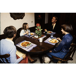 Family seated around a dinner table
