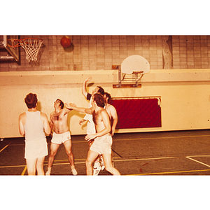 Men playing basketball