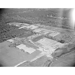 Suburban location of industrial buildings, some new construction, unidentified