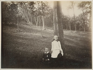 Boy and Girl Sitting and Standing by a Large Tree: Melrose, Mass.