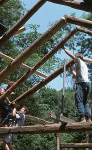 Rafter installation in center west of barn at the Moon Barn Raising at entrance to Hopkins Forest on 2 August 1975.