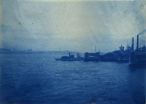 [Unidentified bridge structure being transported over water by tugboats]