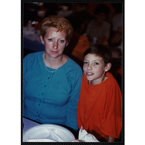 A woman and a boy posing for the camera at a Boys & Girls Club Awards Night