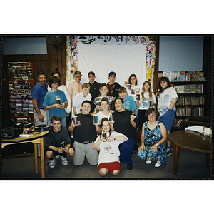 Group portrait of award winners holding their trophies at the Charlestown Best Year In School Program Awards Night