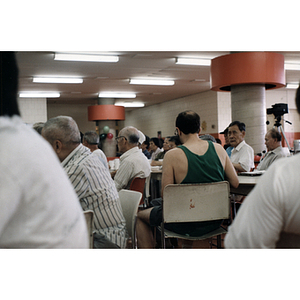 Men and women sit at tables during a Chinese Resident Association celebration