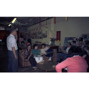 Members wait for a Chinese Progressive Association anniversary event