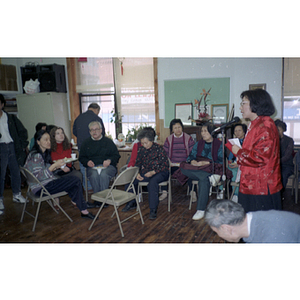 People gather at the Chinese Progressive Association office for a celebration of the Chinese New Year