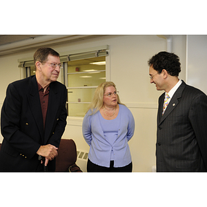 David E. Luzzi, dean of the College of Engineering, talks to a man and woman at the groundbreaking ceremony for the George J. Kostas Research Institute for Homeland Security, located on the Burlington campus of Northeastern University