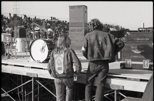 Hollywood Speedway Rock Festival: James Baker and unidentified colleague (l. to r.) at concert stage, both wearing Spirit in Flesh jackets