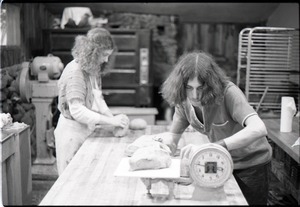 Marleen McCarty and Sammy Wolf, working in commune bakery