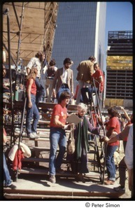 MUSE concert and rally: Maggie Kuhn being helped down the stage stairs