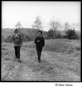Richard Wizansky (right) and Laurie Dodge, walking down a dirt road, Tree Frpg Farm Commune