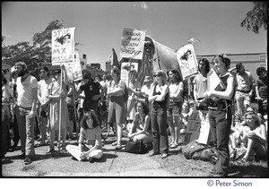 Protesters at a Mobilization for Survival antinuclear demonstration near Draper Laboratory, MIT, carrying signs opposing the MX missile and nuclear power