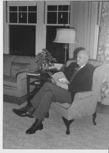 Ralph A. Van Meter reading at home