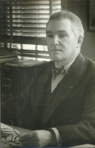 Hugh P. Baker at his office desk